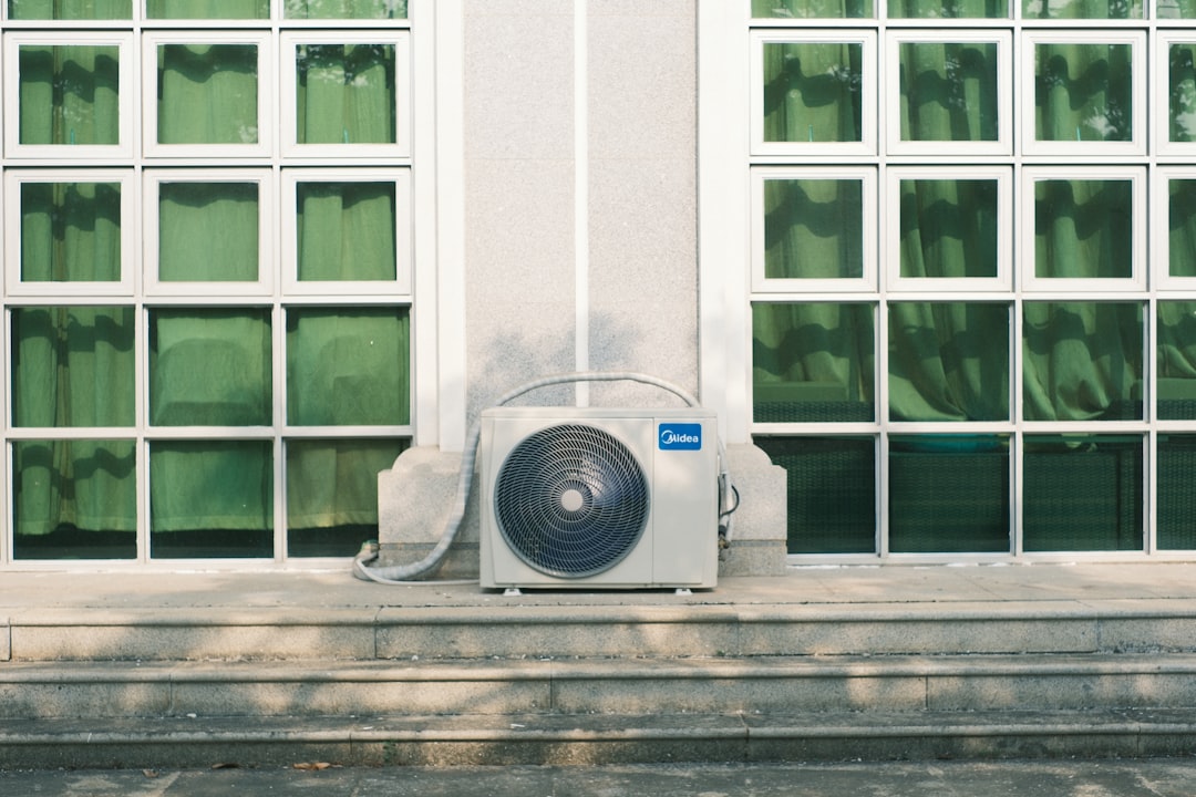 HVAC Blog 2 heat pump outdoor unit residential home modern setting - how does a heat pump work