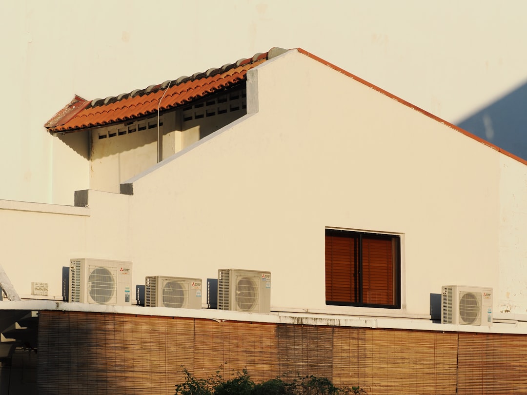 HVAC Blog 3 ductless mini-split unit mounted in modern living room - adding cooling without ductwork options compared